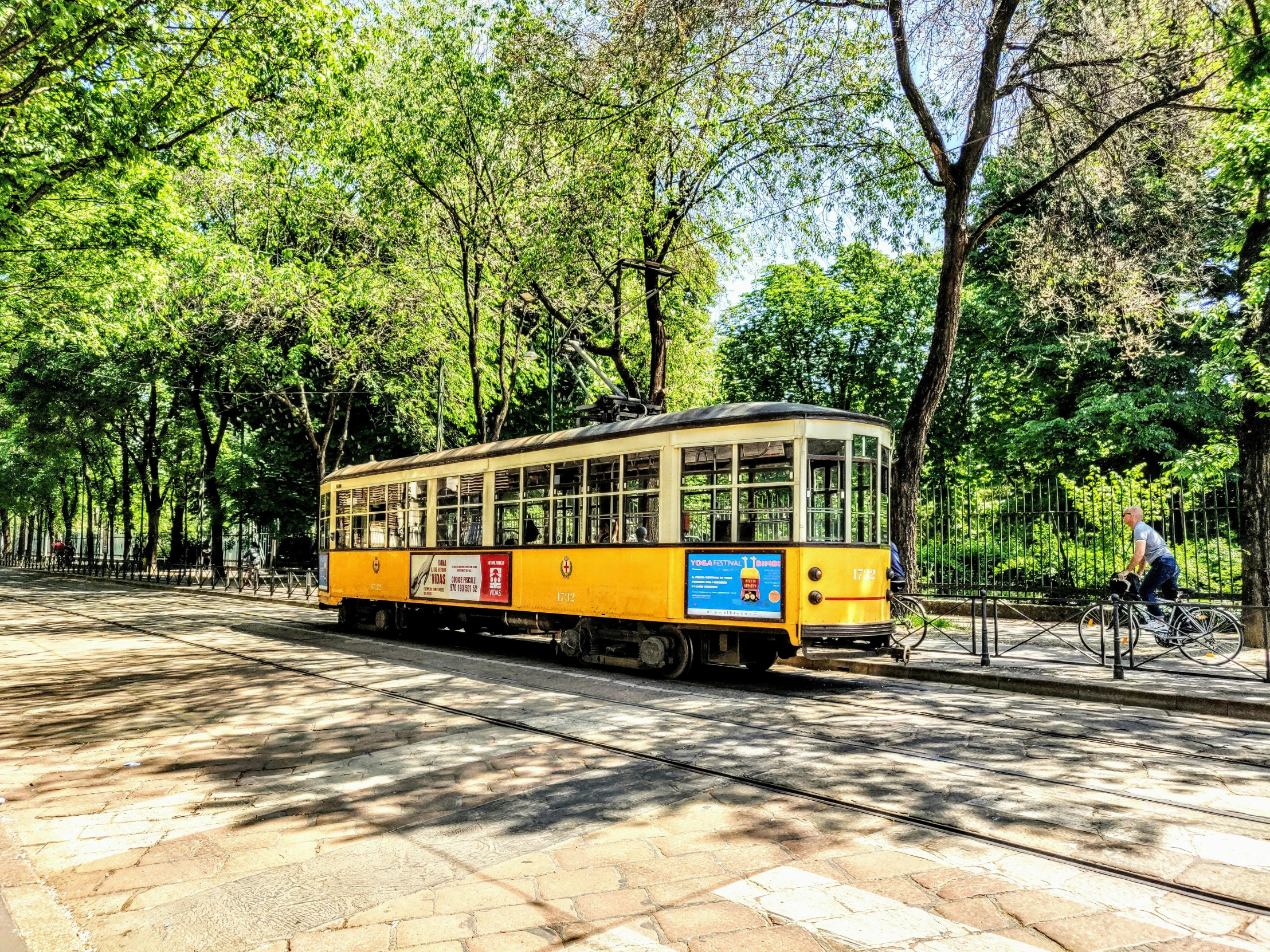 a trolley car on an old tram going down the tracks