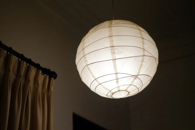 a chinese lantern hanging from the ceiling