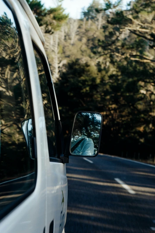 a rear view mirror on a van's side view mirror