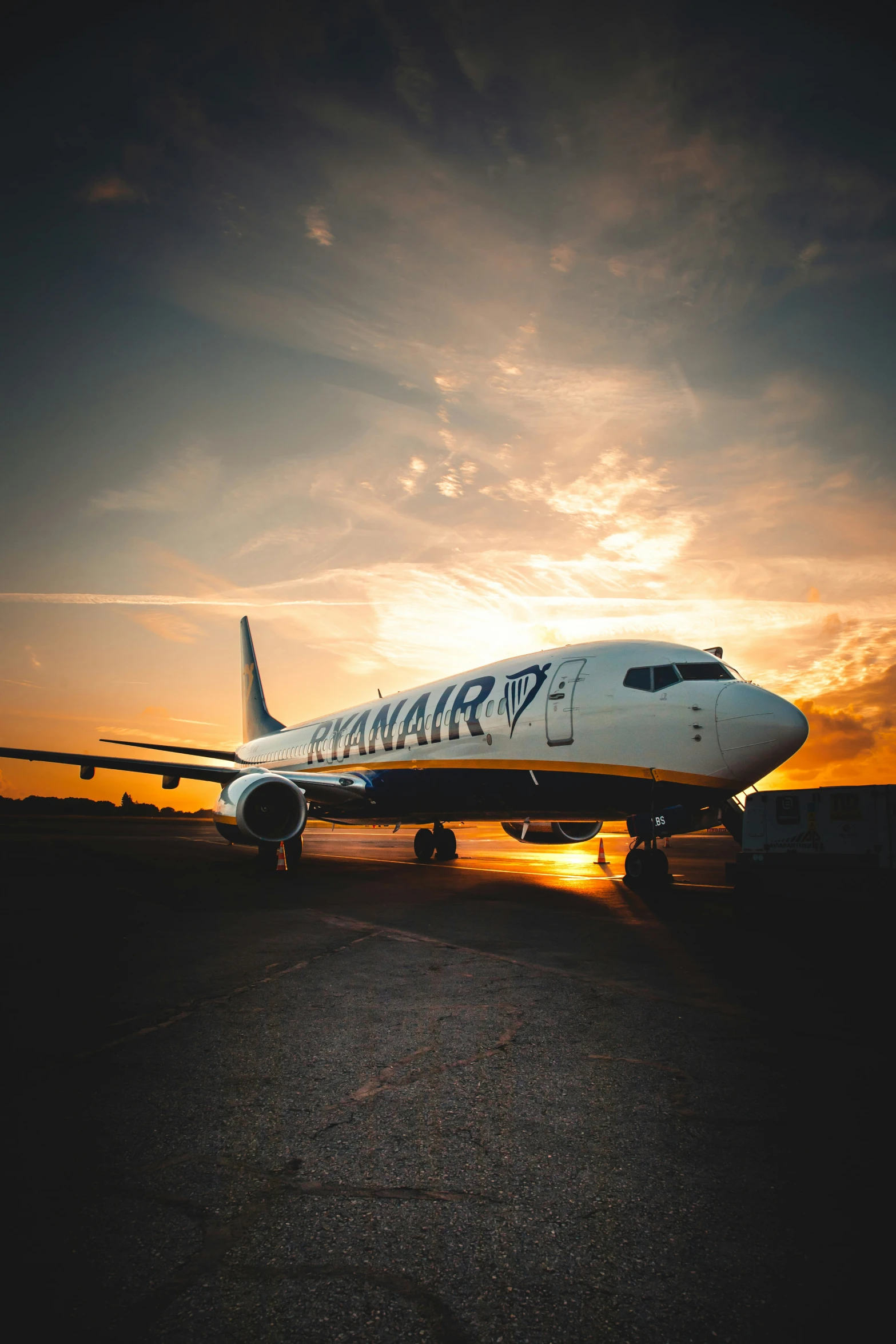 a large white plane on an air port run way