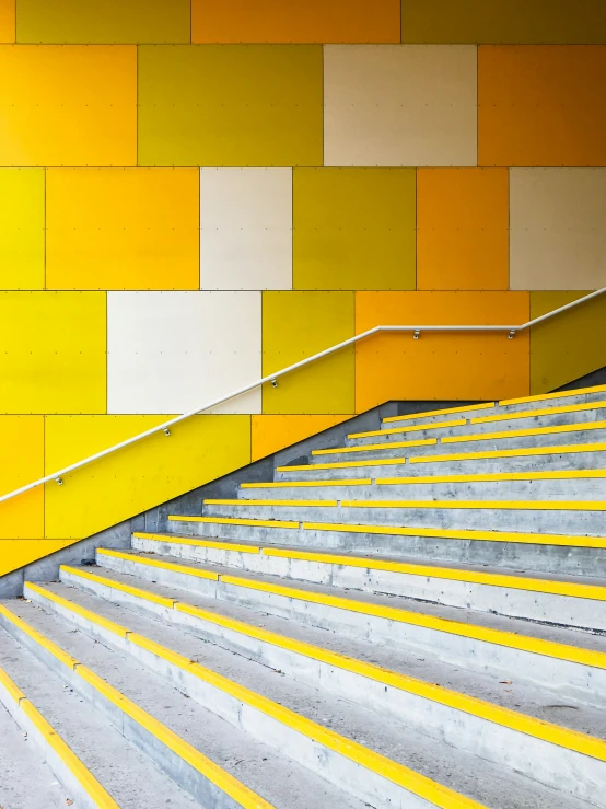 there are some yellow and white striped stairs