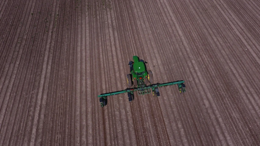 there is a tractor working in the field