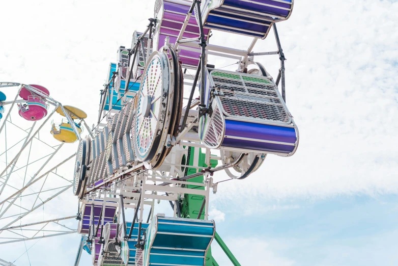 the rides at a carnival have many colorful seats