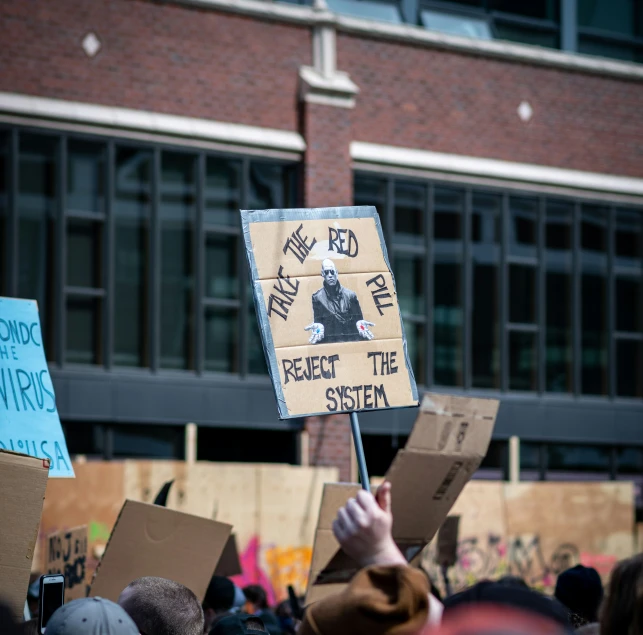 people gathered outside a building protesting the supreme