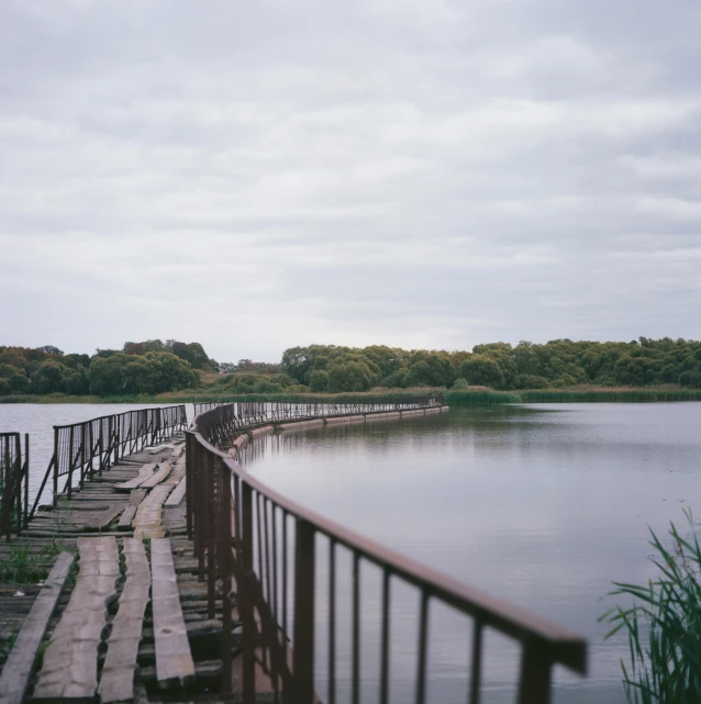 wooden pier on the edge of a large lake