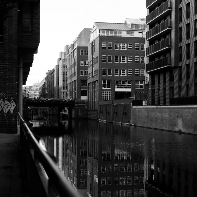 a river runs by some buildings in a city