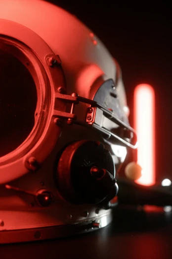 the helmet of a space shuttler with red lighting