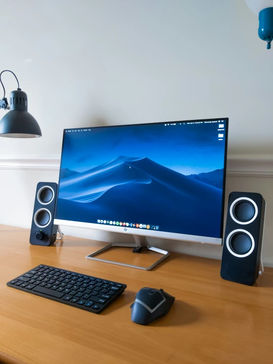 the desktop computer is displayed in front of an external monitor