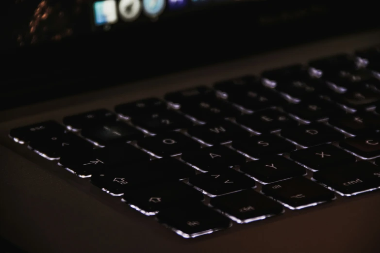 a close up view of the keyboard and mouse of a laptop