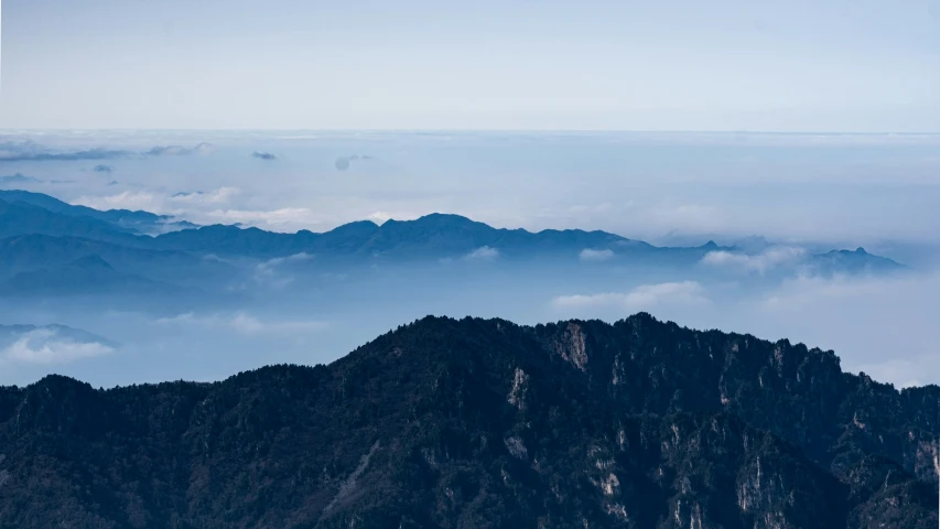 a po taken from top of a mountain looking out over clouds