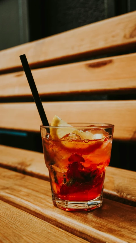 a glass with some ice and a lemon