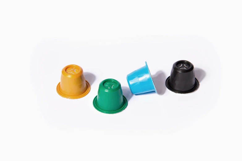 three small plastic caps next to each other