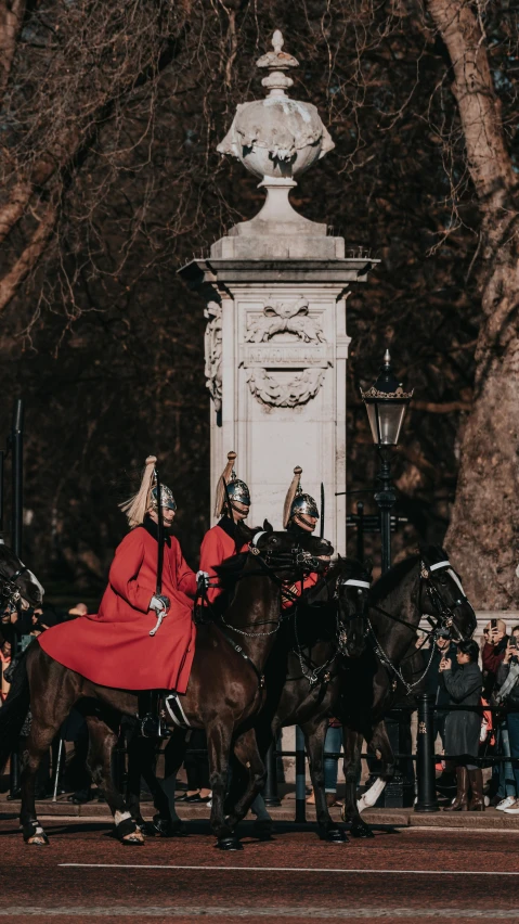 several people dressed in costume riding on horses