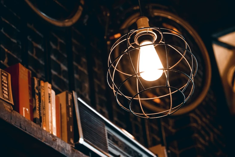 a light bulb in front of bookshelves inside a book store