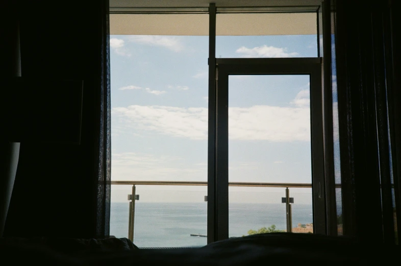 a window overlooking the ocean is empty