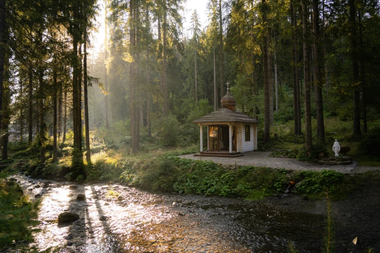 a small pavilion in the middle of a stream