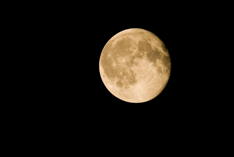 a large, full, moon against a black sky