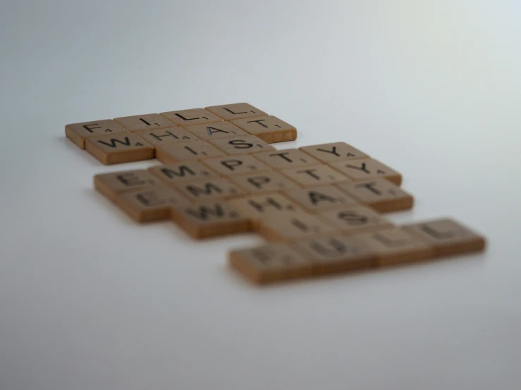 some scrabble tiles with the words wiffle whisk