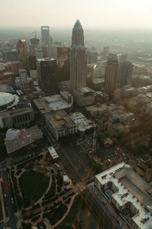 a city from above during a hazy sunrise