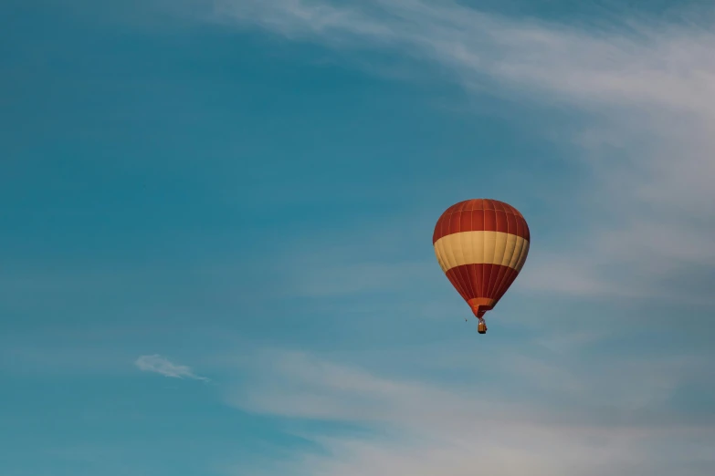 two  air balloons flying in a clear blue sky