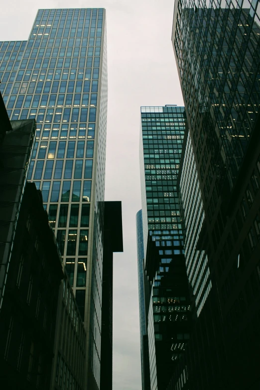 an upward view of multiple high rise buildings