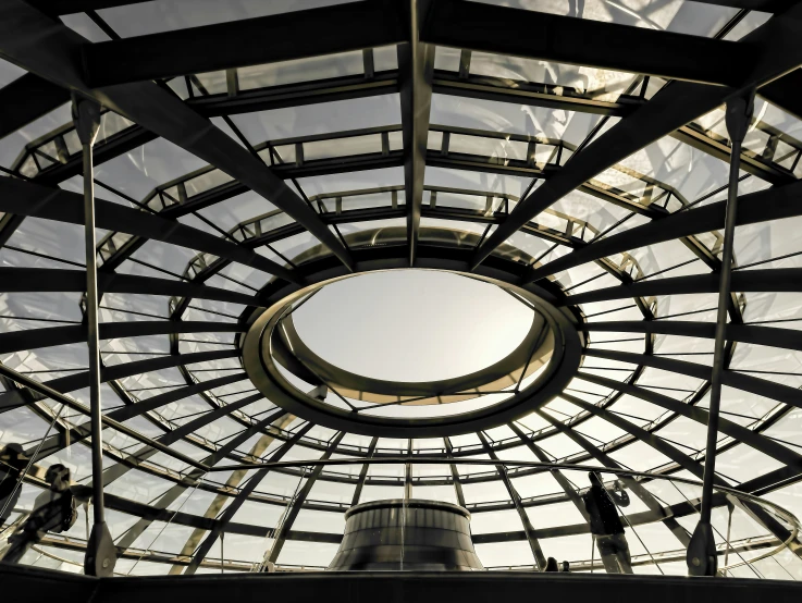 the inside of a building with the sky above