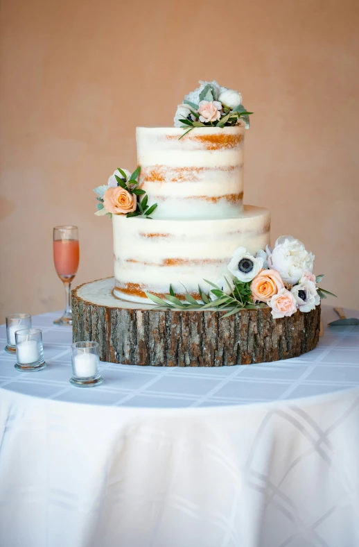 an elegant wedding cake is displayed on top of a table