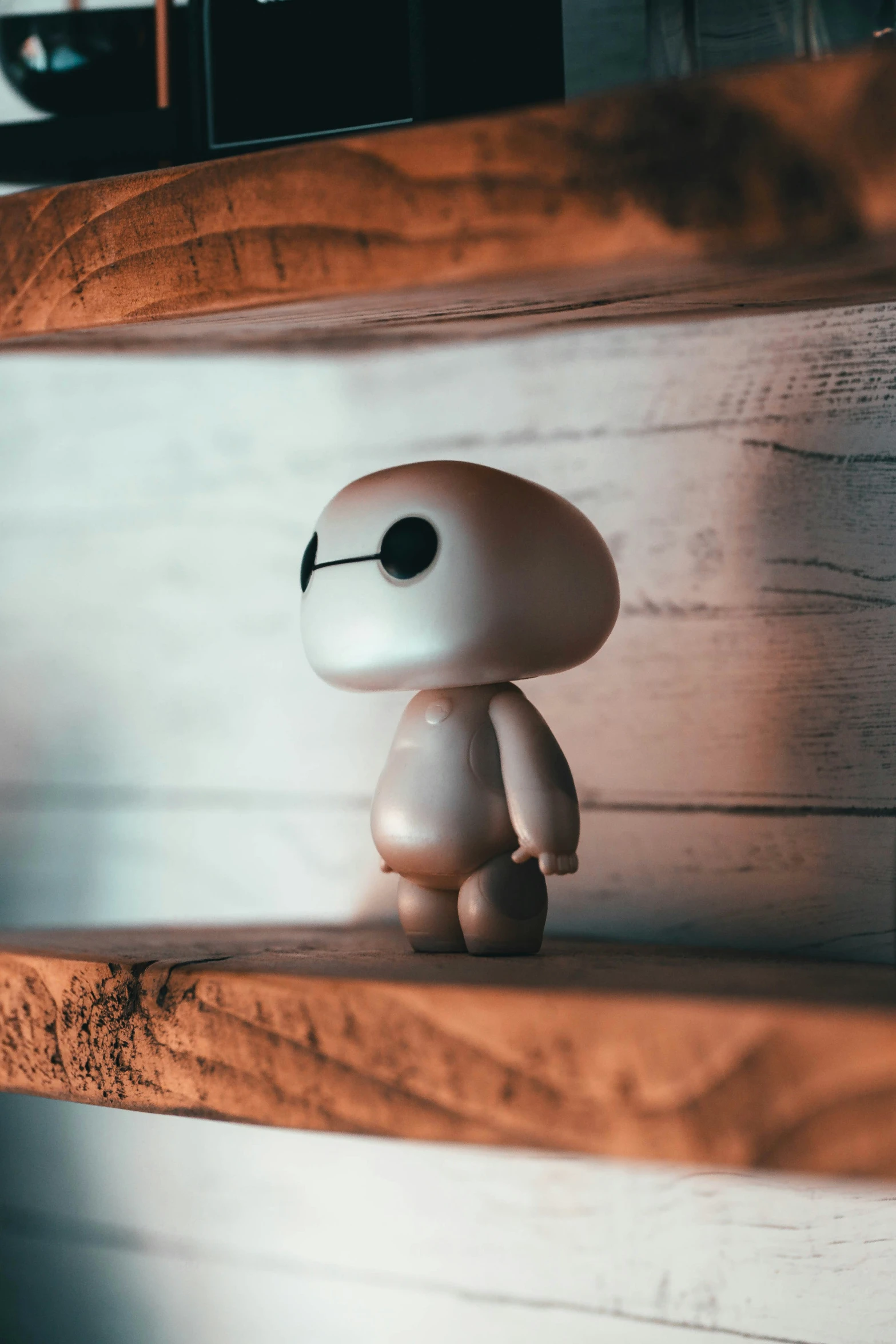 a small figurine of the little ghost is on a white shelf