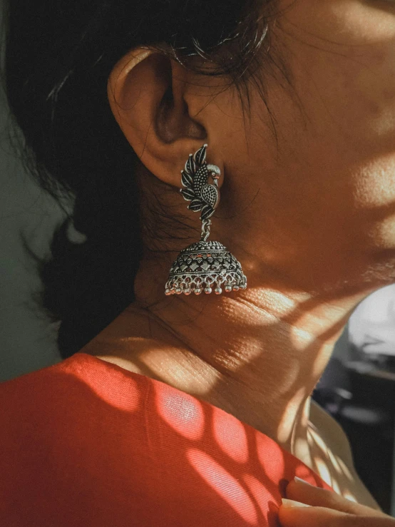 a woman wearing some jewelry on her back