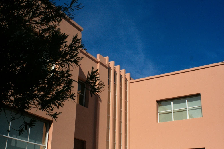 a building is shown with windows and a light in the background