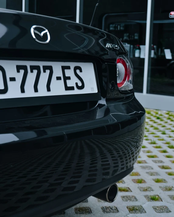 the back end of a mazda car is shown