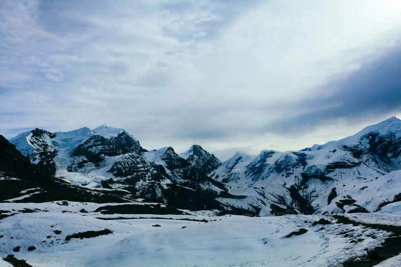 an incredible view of snow covered mountains in the distance