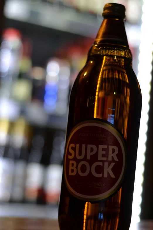 an opened bottle of beer sitting on top of a table