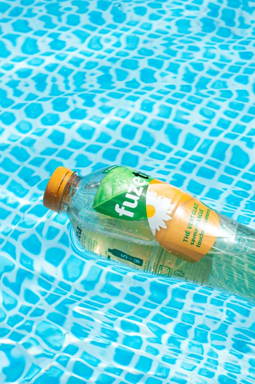 a bottle in the middle of a swimming pool