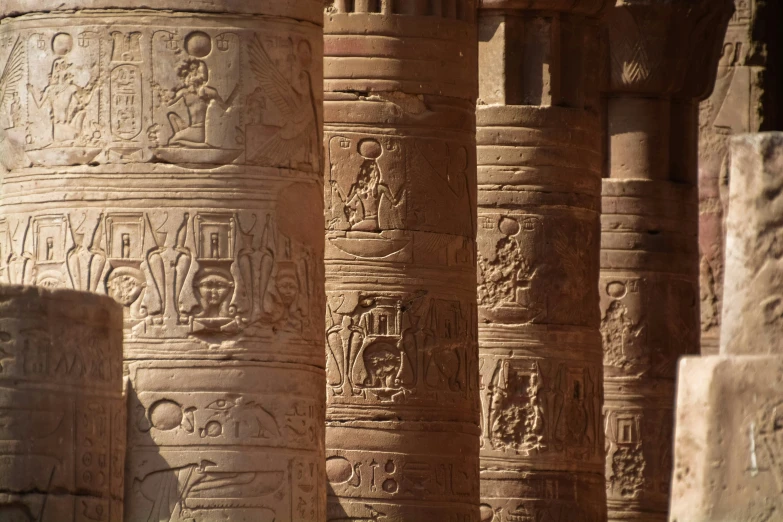 a close up of pillars in an ancient building