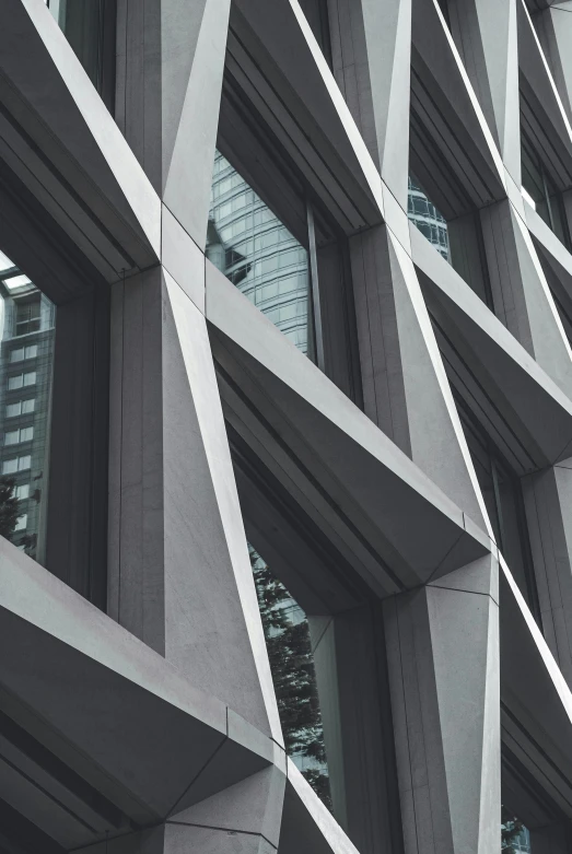 an unusual building with modern windows and a sky scr