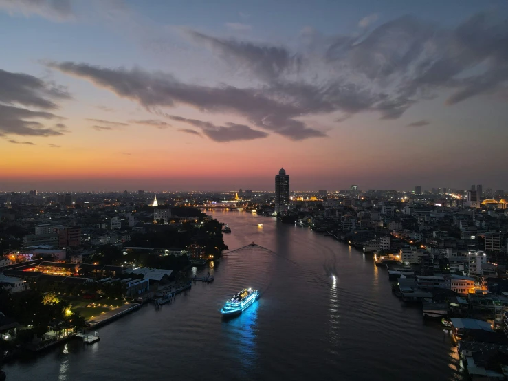 an aerial view of the river and skyline at night