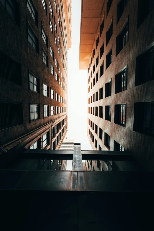 an empty courtyard with glass windows is shown