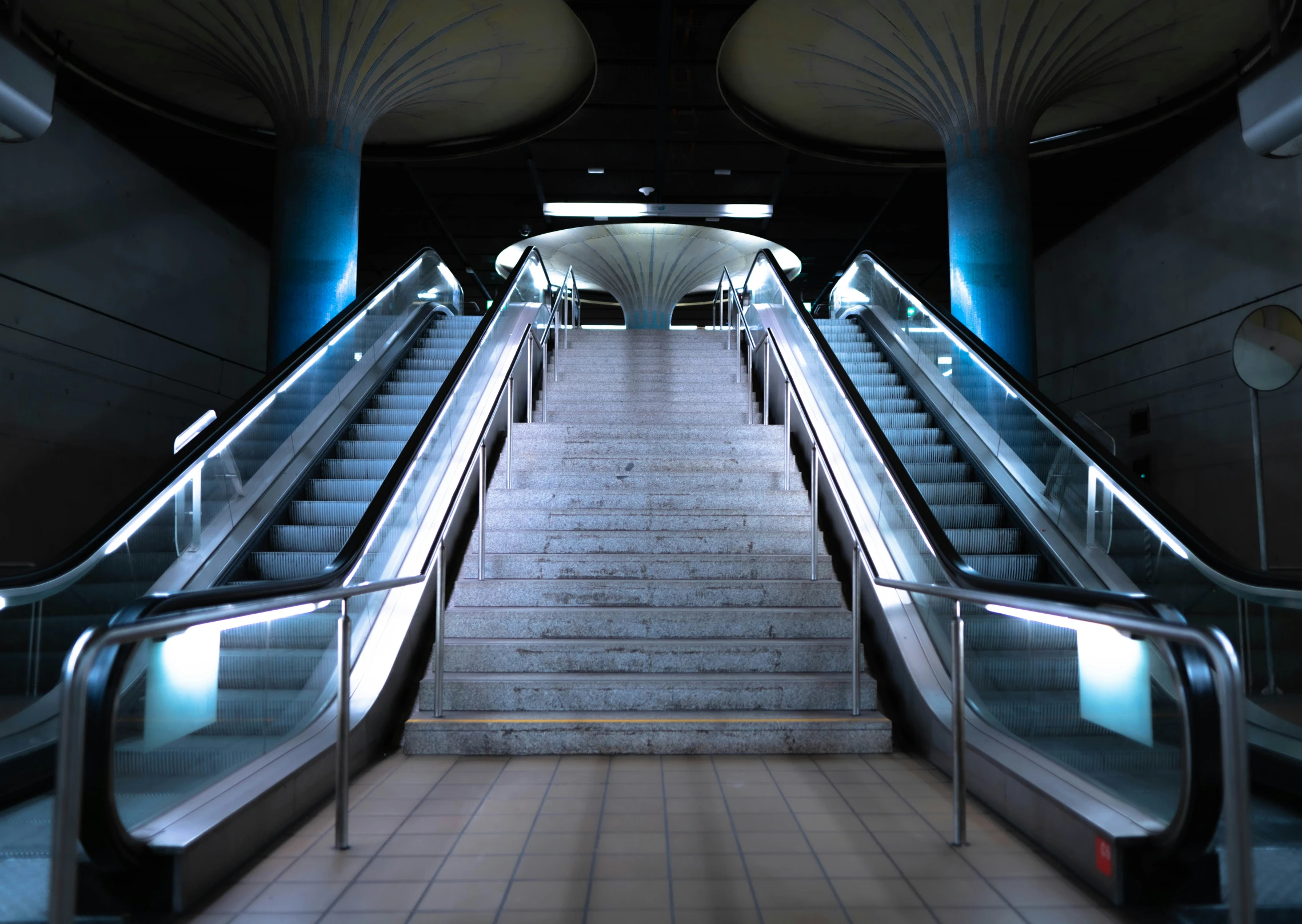 a set of stairs leading to several doors