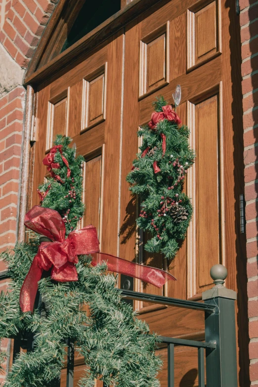 the two green wreaths are by the door