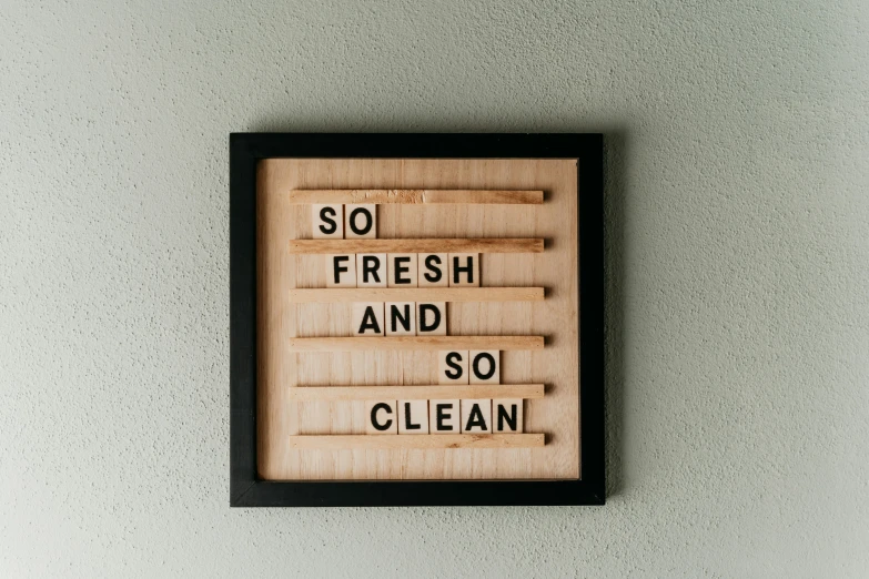 a wooden sign that says so fresh and so clean