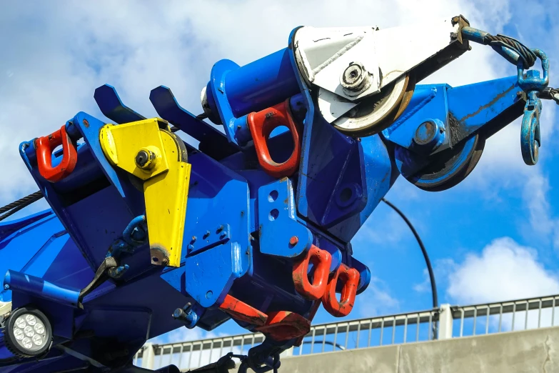 the colorful sculpture is standing out against the blue sky