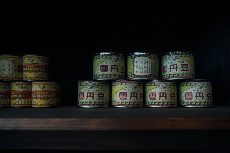 a stack of tins and various containers stacked on each other