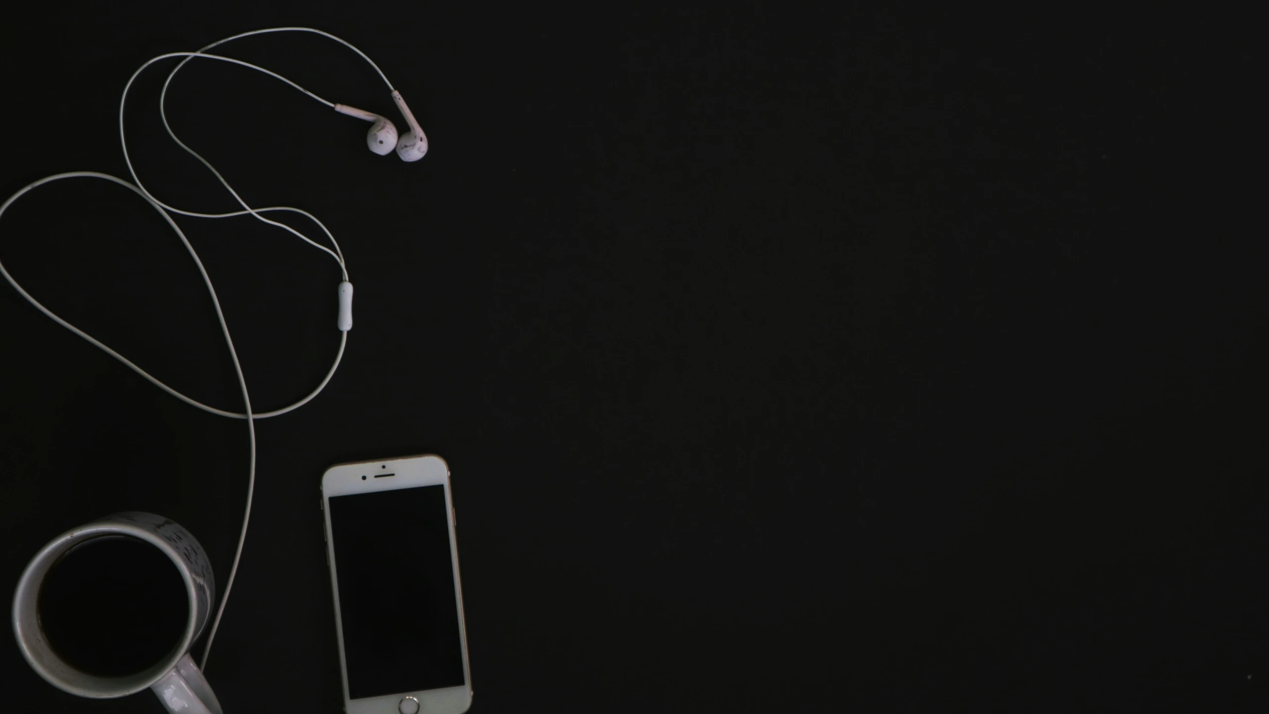 two cell phones sitting next to each other on a table