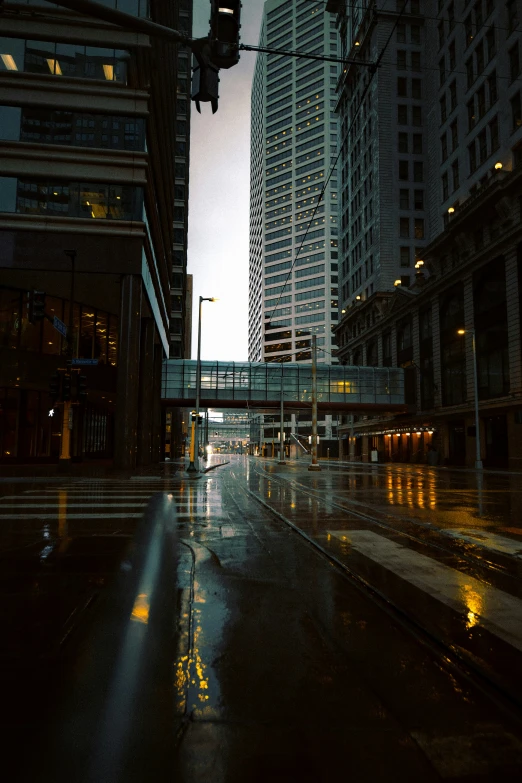 a city street in the rain at night