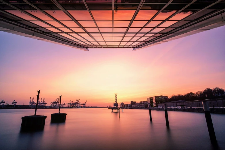 a view of the sea from under a building