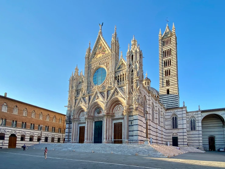 an ancient cathedral with two towers and no cars