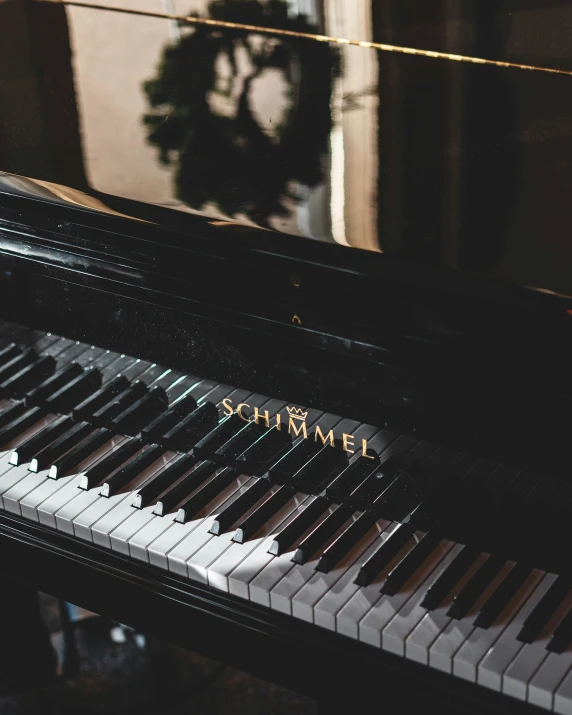 close up s of a piano near a wall