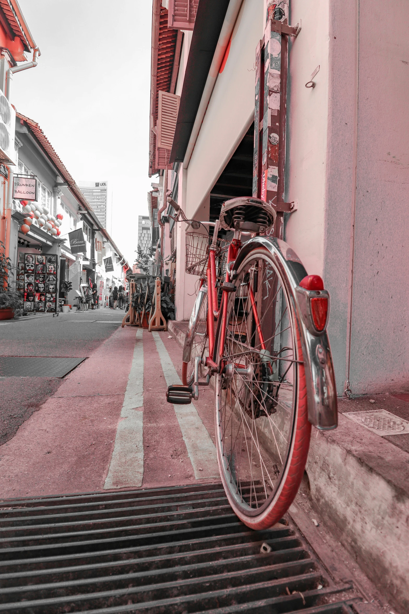 a bicycle is sitting on the side of a building