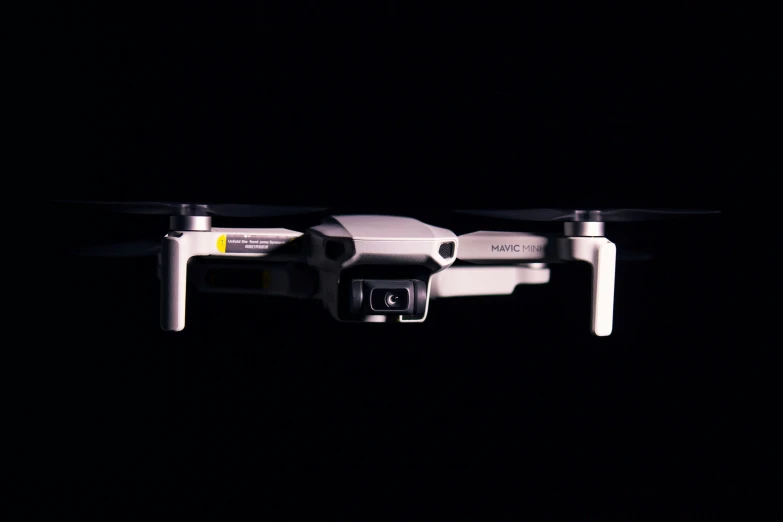 a flying camera attached to a large white object